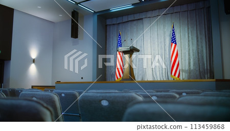 Press campaign room with seats and American flags 113459868