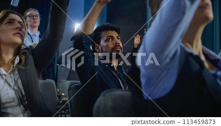 Indian male media representative raises hand and asks question Indian male media representative raises hand and asks question 113459873