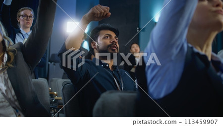 Indian male media representative raises hand and asks question Indian male media representative raises hand and asks question 113459907