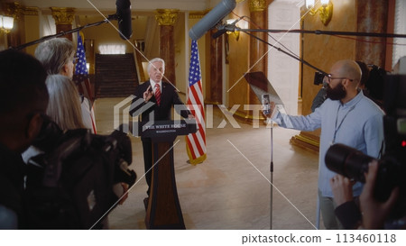 Senior president of United States surrounded by journalists Senior president of United States surrounded by journalists 113460118