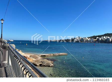 Coast and promenade of the town of Bugibba in Malta on a clear sunny day 113460165