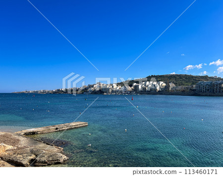 Coast and promenade of the town of Bugibba in Malta on a clear sunny day Coast and promenade of the town of Bugibba in Malta on a clear sunny day 113460171