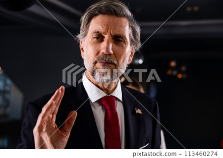 American politician talks with journalists, gives interview for media and television news 113460274