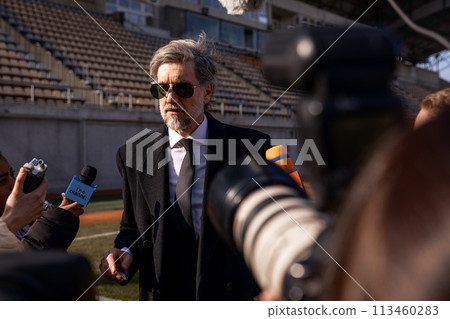 Interview of football team director at press conference for TV Interview of football team director at press conference for TV 113460283