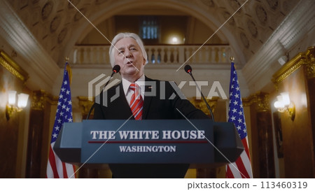 US government representative gives political speech at press conference 113460319