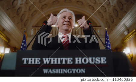 New President of the United States smiles and gestures during press campaign New President of the United States smiles and gestures during press campaign 113460326