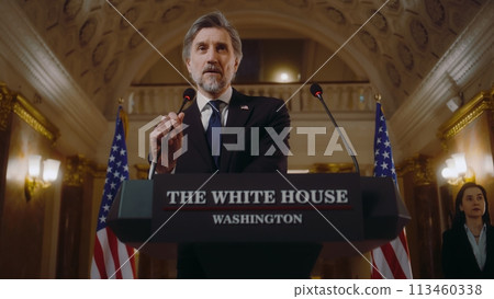 US President comes to tribune and starts inspirational speech 113460338