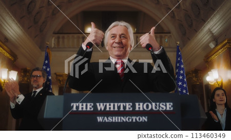 Senior American minister gestures and poses on cameras 113460349