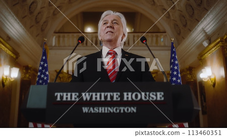 US government representative gives political speech at press conference 113460351