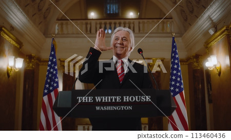 New President of the United States smiles and gestures during press campaign 113460436