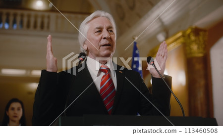 US government representative gives political speech at press conference US government representative gives political speech at press conference 113460508