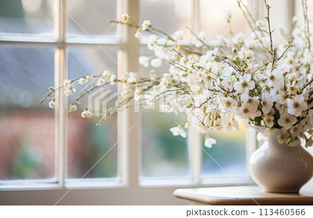 Beautiful bouquet of flowers in a vase on the windowsill 113460566