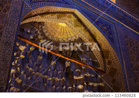 Inside the mausoleum, deep niches and diverse muqarnas decoration. Gur-e-Amir Inside the mausoleum, deep niches and diverse muqarnas decoration. Gur-e-Amir 113460828