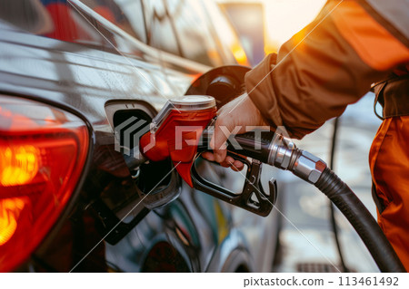 Hand refilling the car with fuel at the refuel station. Generative AI 113461492