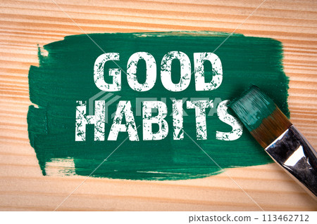 Good Habits. Text, green color and paint brush on wood texture background Good Habits. Text, green color and paint brush on wood texture background 113462712