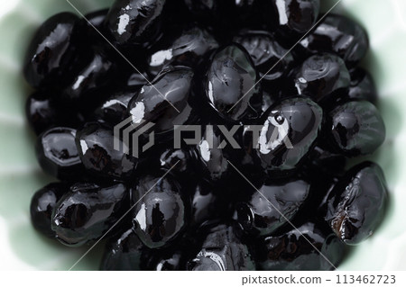 Black beans on a white background Black beans on a white background 113462723