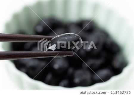 Black beans on a white background Black beans on a white background 113462725