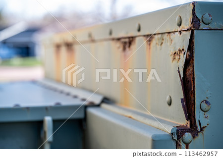 Rusted and peeling paint on an electrical transformer exposed to the elements. Rusted and peeling paint on an electrical transformer exposed to the elements. 113462957