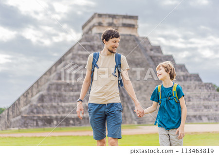 Father and son tourists observing the old pyramid and temple of the castle of the Mayan architecture known as Chichen Itza these are the ruins of this ancient pre-columbian civilization and part of 113463819
