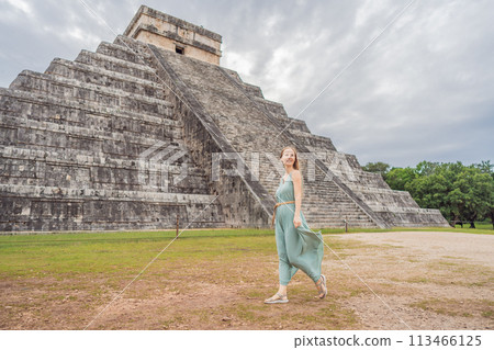 Beautiful tourist woman observing the old pyramid and temple of the castle of the Mayan architecture known as Chichen Itza these are the ruins of this ancient pre-columbian civilization and part of Beautiful tourist woman observing the old pyramid and temple of the castle of the Mayan architecture known as Chichen Itza these are the ruins of this ancient pre-columbian civilization and part of 113466125