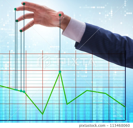 Businessman controlling the market with strings 113468060