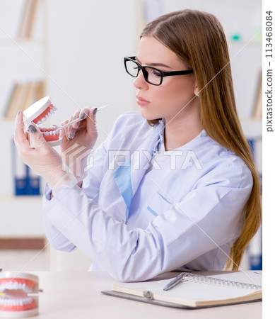 Dentistry student practicing skills in classroom Dentistry student practicing skills in classroom 113468084