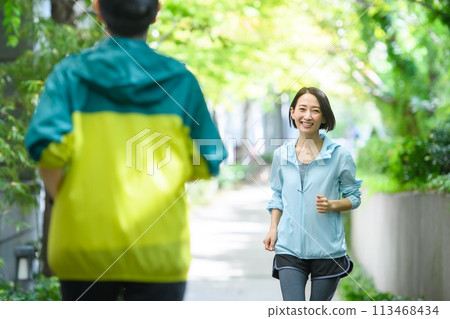 Runners passing each other, running 113468434