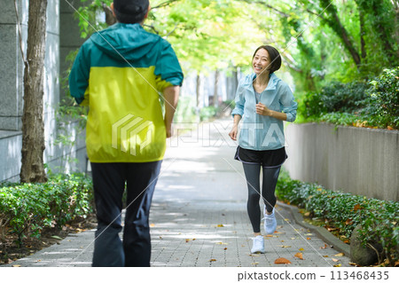 Runners passing each other, running Runners passing each other, running 113468435