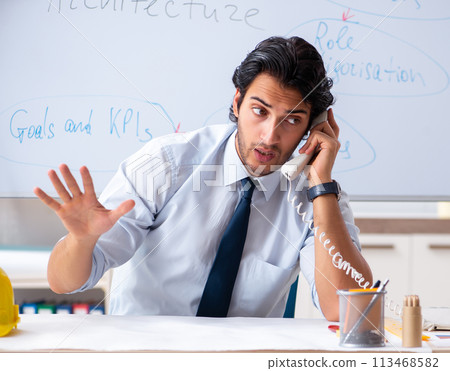 Young male architect in front of the whiteboard 113468582
