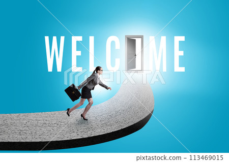 Businesswoman on the road leading to welcome sign Businesswoman on the road leading to welcome sign 113469015