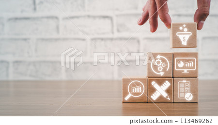 CRO, Conversion Rate Optimization concept, Hand holding wooden block on desk with Conversion Rate Optimization icon on virtual screen. CRO, Conversion Rate Optimization concept, Hand holding wooden block on desk with Conversion Rate Optimization icon on virtual screen. 113469262