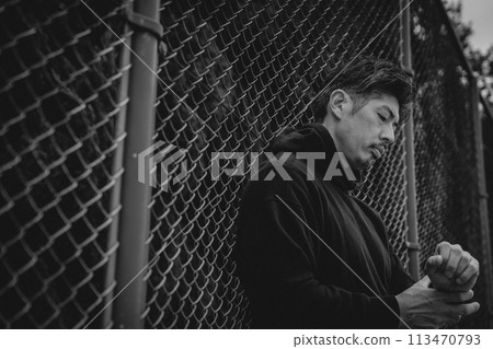 A man waiting for someone outside A man waiting for someone outside 113470793