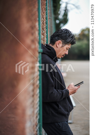 40s, male, smartphone, outdoors 113470979