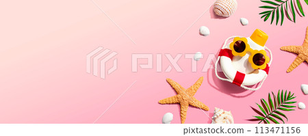 Sunblock bottle wearing sunglasses with starfish and seashells 113471156