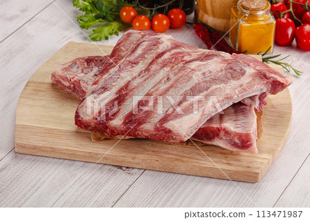 Raw pork ribs over board Raw pork ribs over board 113471987