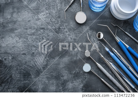 AI generated Row of various dental tools isolated on gray background. AI generated Row of various dental tools isolated on gray background. 113472236