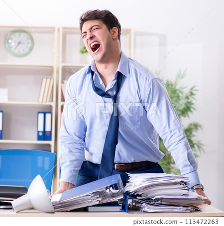 Angry businessman frustrated with too much work 113472263