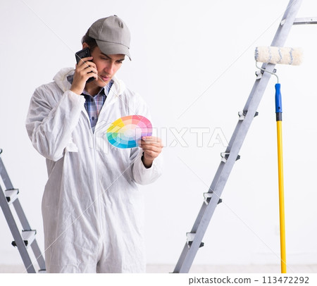 Painter working at construction site Painter working at construction site 113472292
