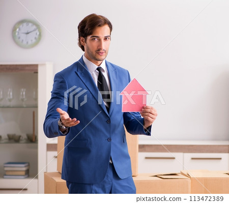 Young handsome realtor selling flat Young handsome realtor selling flat 113472389