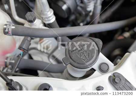 Windshield washer fluid tank in the engine compartment Windshield washer fluid tank in the engine compartment 113473200