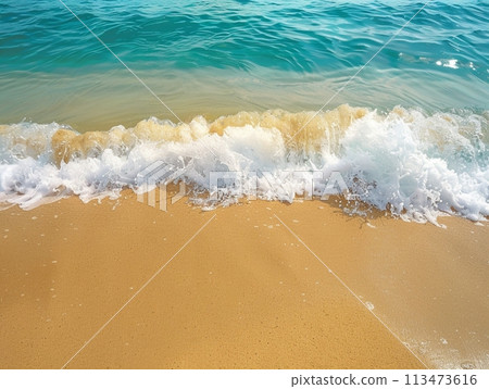 Beach Waves Serenity: A tranquil scene of waves gently caressing the sandy shore under a clear blue sky, embodying the essence of a peaceful seaside retreat 113473616