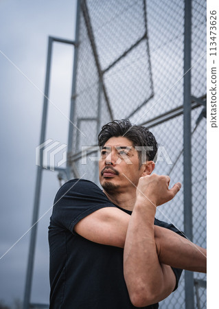Man warming up outdoors Man warming up outdoors 113473626