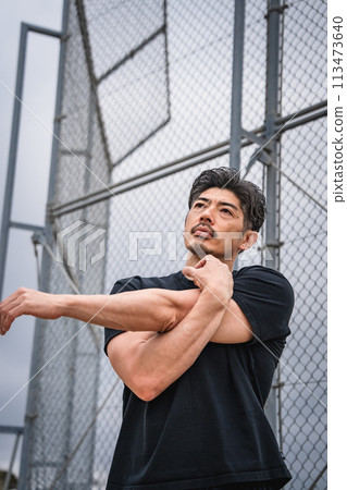 Man warming up outdoors Man warming up outdoors 113473640
