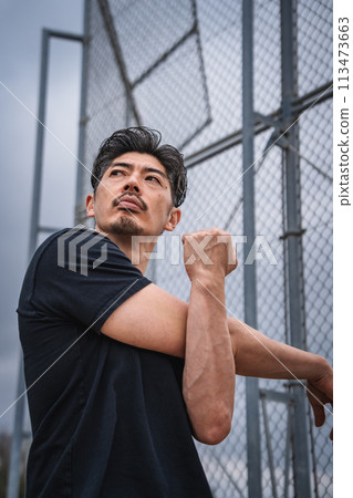 Man warming up outdoors Man warming up outdoors 113473663