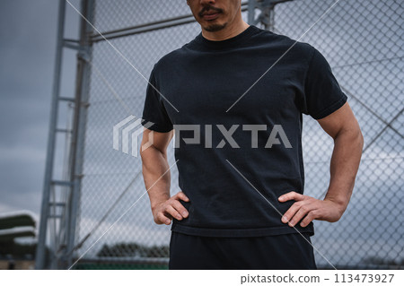 A man in his 40s taking a break during outdoor training A man in his 40s taking a break during outdoor training 113473927