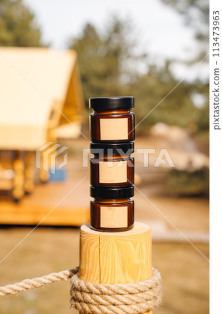Scented candles on a wooden pole Scented candles on a wooden pole 113473963