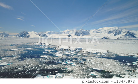 Antarctica Peninsula Ocean Shore Seascape Aerial View. Arctic Majestic Brash Ice Floe on Mountain Horizon. Sunny Day Global Warming Concept in Alaska Landscape Drone 113473978