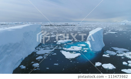 Antarctica Iecberg Float Ocean Glacier Aerial View. Polar Winter Peninsula Open Water Coast Melting Ice. Extreme Climate Change Concept Drone Flight Antarctica Iecberg Float Ocean Glacier Aerial View. Polar Winter Peninsula Open Water Coast Melting Ice. Extreme Climate Change Concept Drone Flight 113473982