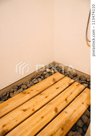 wooden pallet on stones. Shower in glamping. wooden pallet on stones. Shower in glamping. 113474110