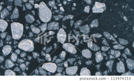 Antarctica ocean brash ice water. Zoom out top down aerial view. Flight in Antarctic melting ice glacier surface. Global Warmig Polar Nature Concept. Above Drone 113474153